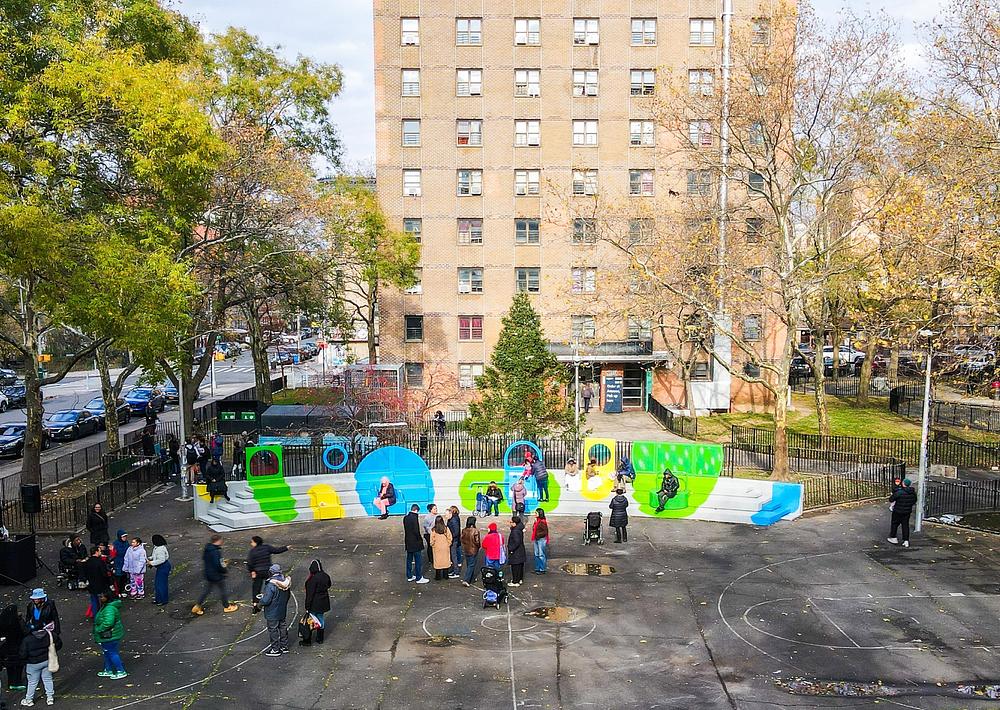 The installation is organized into zones that encourage social, active, and imaginative play.