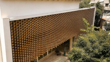 A Wooden Cube Facade Shaped by Light and Order