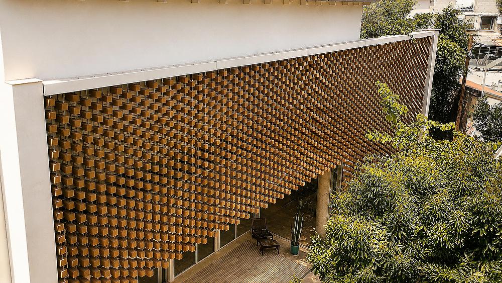 A Wooden Cube Facade Shaped by Light and Order