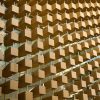 A Wooden Cube Facade Shaped by Light and Order