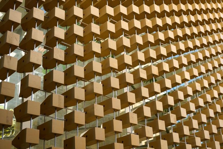 A Wooden Cube Facade Shaped by Light and Order
