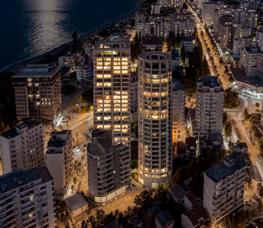 Duas Towers Rise Between Mountains and Sea