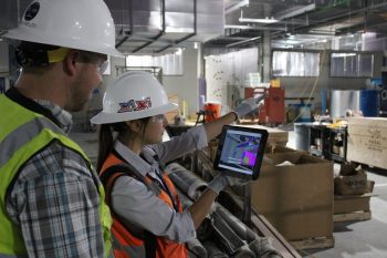 Construction team reviewing information together at a jobsite